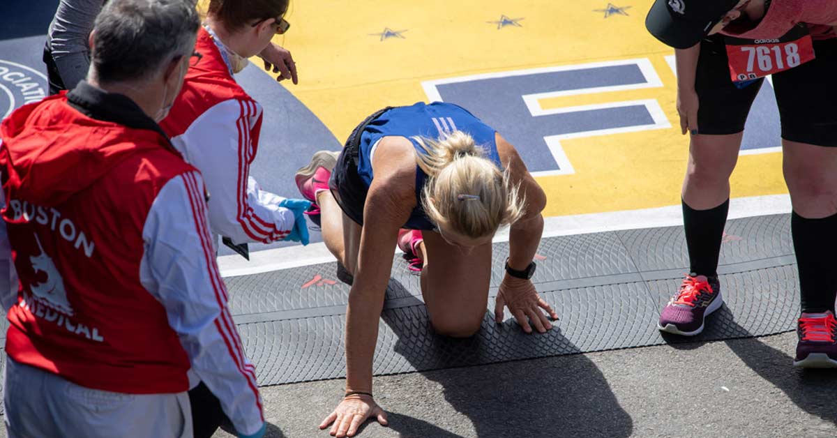 Crawl Finish|USA Softball Bracket|Soccer Softball Games|Fall Structure|Surf College Cup Parking|Four young female athletes wearing maroon and white uniforms with Northshore lettering